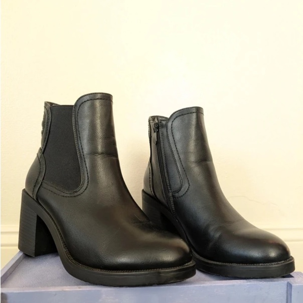 Sleek Black Leather Heeled Boots